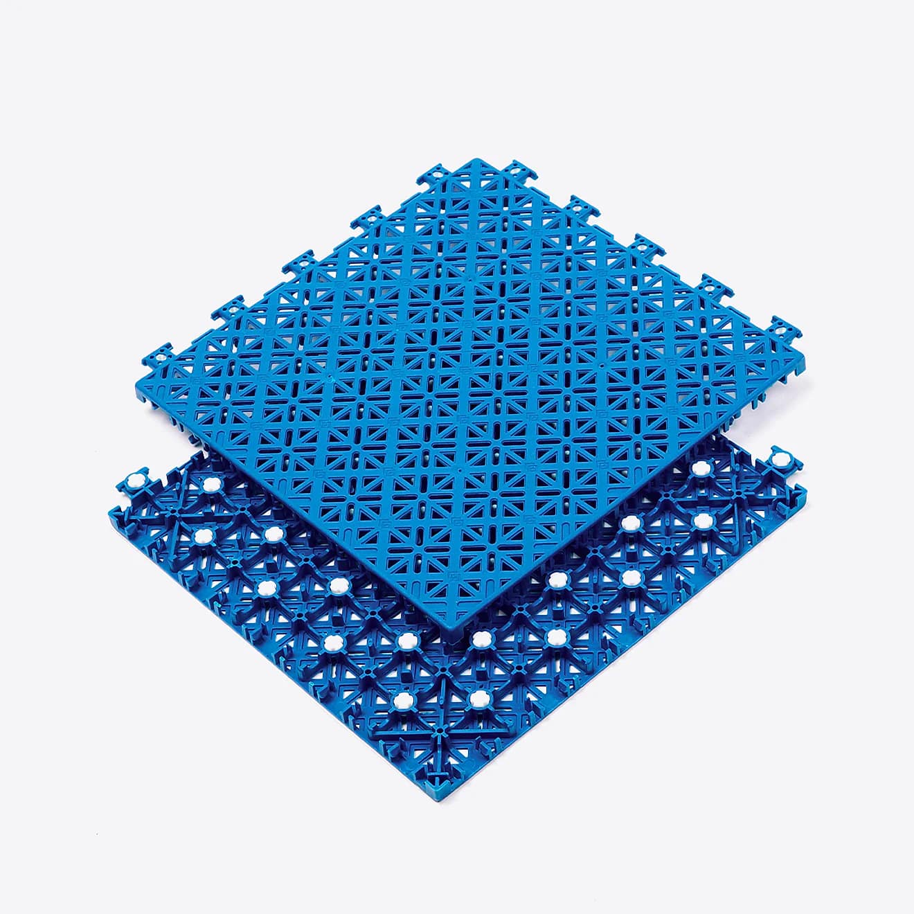Blue Arena X300 modular sports court tiles showing the open-grid top, underside structure, connectors, and white cushioning pads.