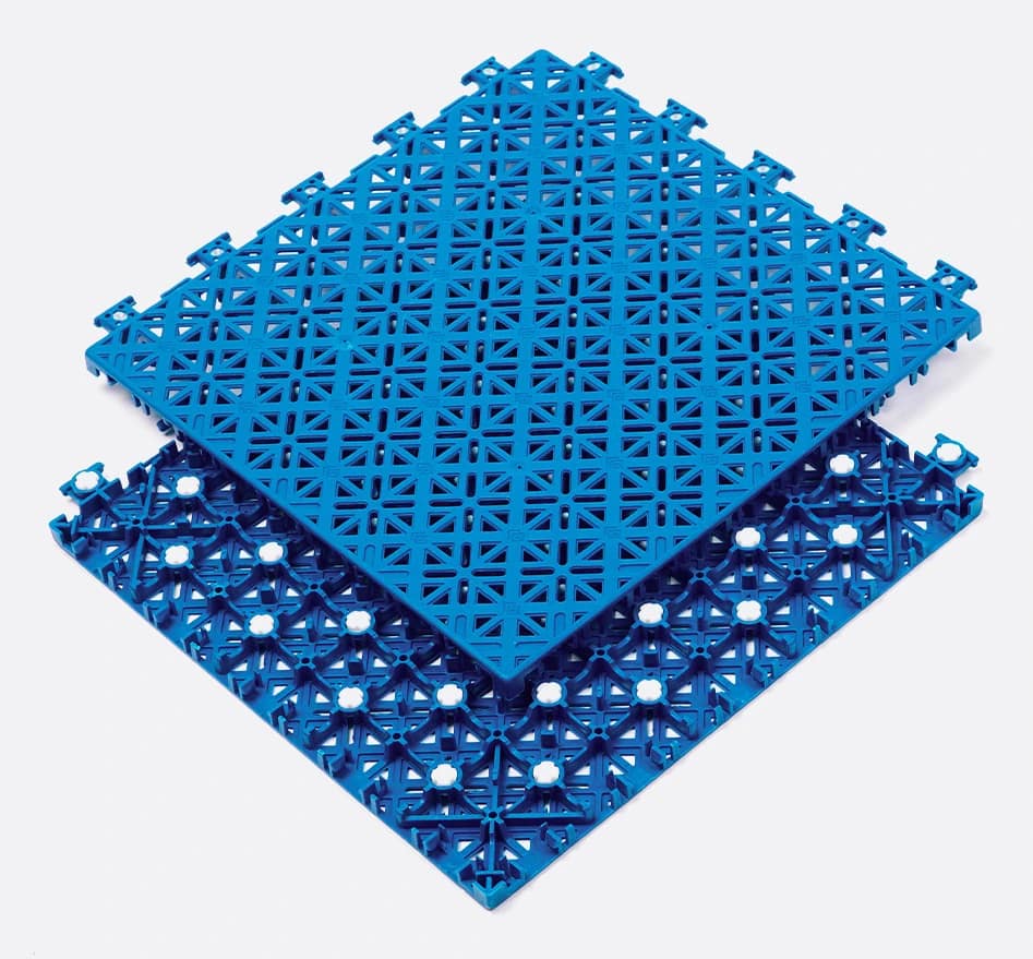 Two blue Arena X300 court tiles separated to show the open-grid surface, underside structure, and connector geometry.