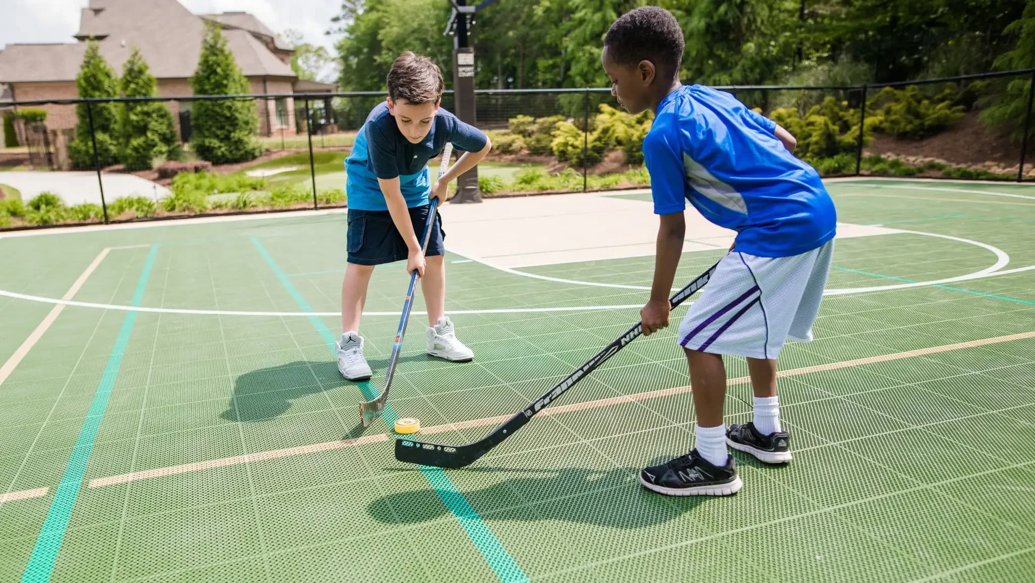 Arena X300 Court Tiles installed in an outdoor sports space.